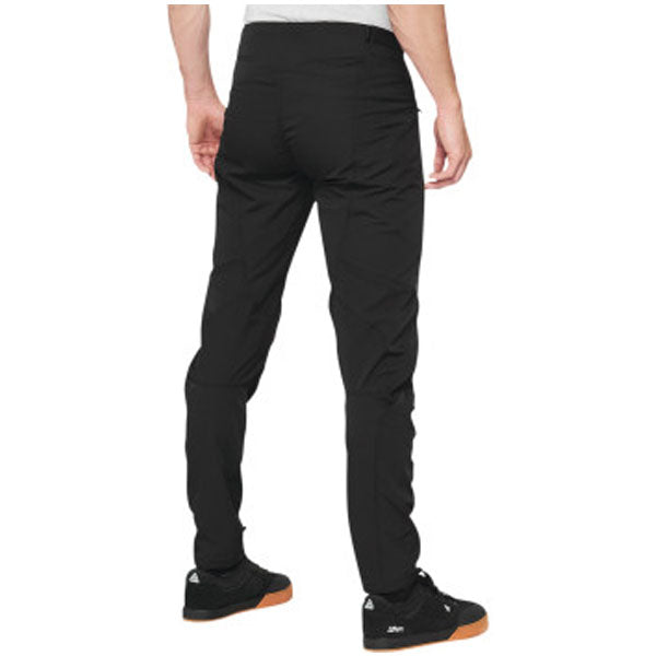 Detailed studio photograph of 100%, Airmatic Pants (MTB), SKU 50100048, color options Black, Charcoal, sizes 28–38, Designed for Mountain Bike, BMX and E-Bike riders