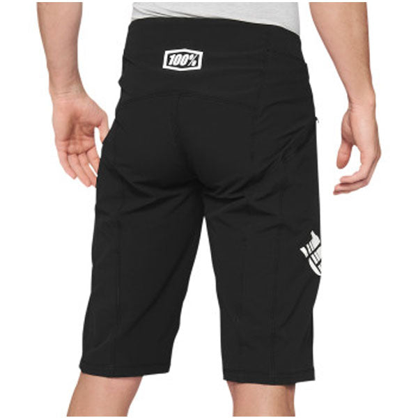 Studio image highlighting 100%, R-Core X Shorts (MTB), SKU 50010166, color Black, sizes 28–38, Designed for Mountain Bike, BMX and E-Bike riders