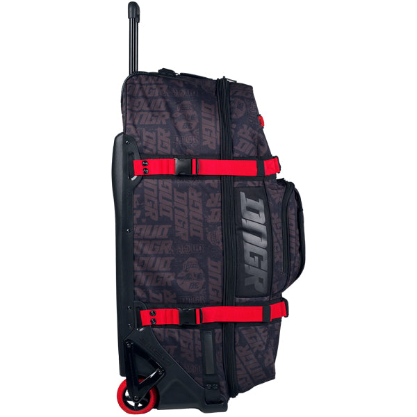 Side profile view of OGIO RIG 9800 DNGR X bag showing black DNGR pattern, large vertical DNGR logo panel, red side straps, and exposed wheel and base frame, SKU 80100025 | Available at BTO Sports