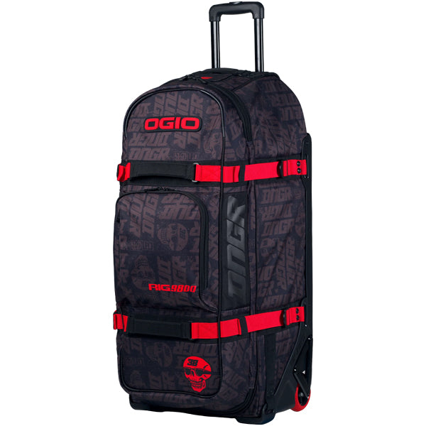 Angled front-left view of upright OGIO RIG 9800 DNGR X gear bag highlighting front pocket with DNGR skull graphic, red straps, and pull handle extended from the top, SKU 80100025 | Available at BTO Sports