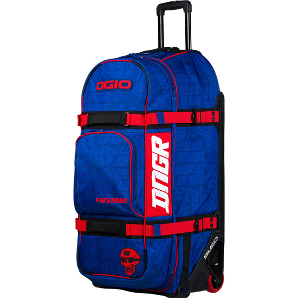 Angled front-left view of the blue OGIO RIG 9800 DNGR X displaying DNGR graphic pattern, red straps, front pocket, and red DNGR skull graphic near the base. SKU 80100024 | Available at BTO Sports
