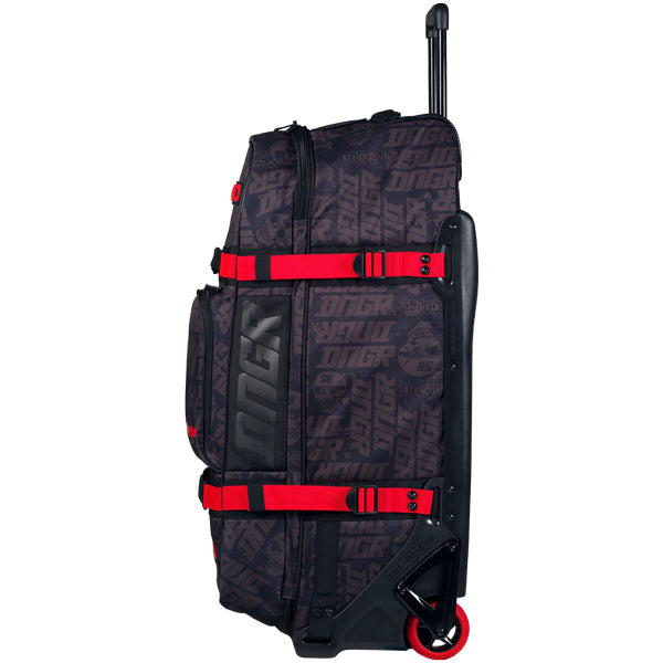 Opposite side profile of OGIO RIG 9800 DNGR X bag displaying DNGR logo panel, red compression straps, telescoping handle extended, and single red wheel at the base, SKU 80100025 | Available at BTO Sports