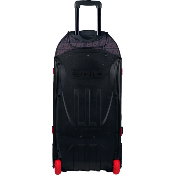 Rear view of OGIO RIG 9800 DNGR X gear bag showing hard black SLED base with molded ribs, integrated OGIO logo, red wheels, and telescoping handle, SKU 80100025 | Available at BTO Sports