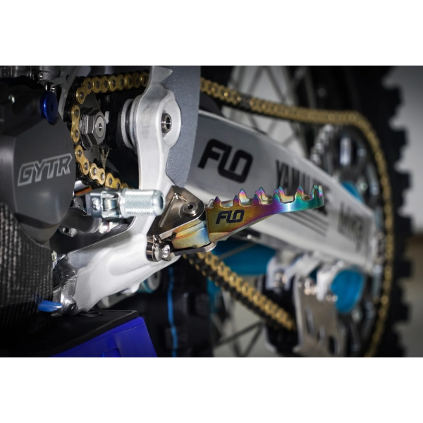 Clean studio shot of Flo Motorsports - Pro Series Titanium Footpegs; showing overall shape and visible design details; SKU 122-8026T