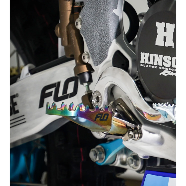 Professional studio photo of Flo Motorsports - Pro Series Titanium Footpegs; showing overall shape and visible design details; SKU 122-8026T