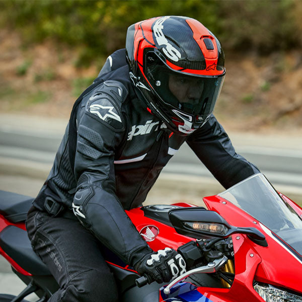 Carbon/Red/White product view, lightweight off‑road motorcycle helmet with ventilation and impact protection