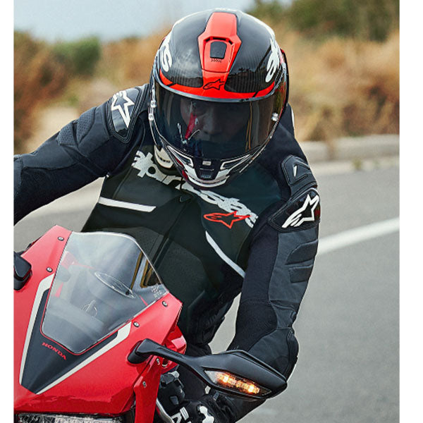Carbon/Red/White product view, lightweight off‑road motorcycle helmet with ventilation and impact protection
