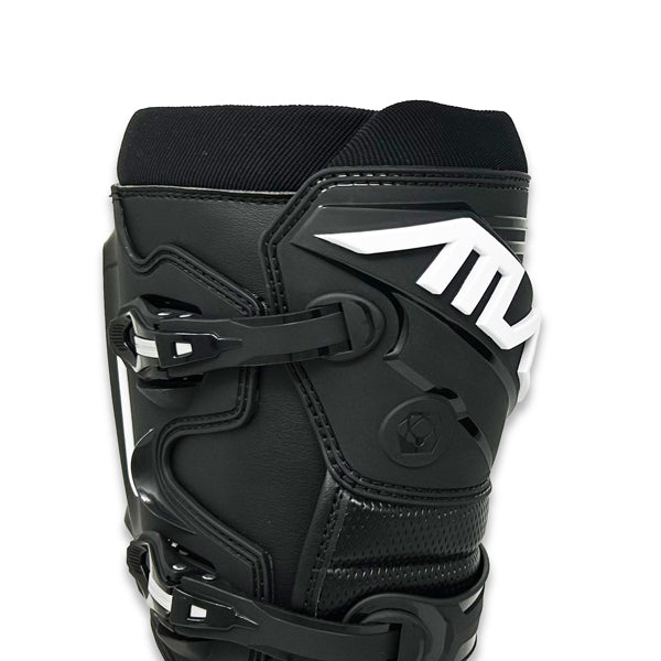A close-up view of the upper portion of a black Atlas Traction Boot (SKU: A50000107). The image focuses on the secure, easy-to-use four-buckle closure system with adjustable straps, as well as the hollow molded shin plate and cushioned tongue.