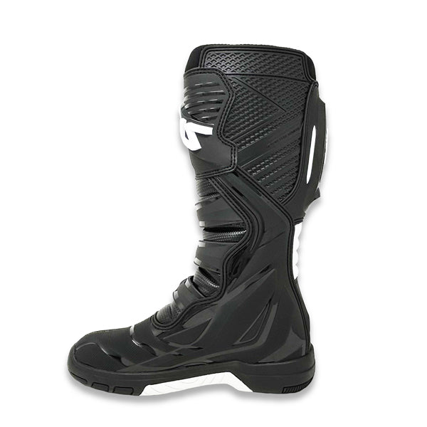 A side view of a single black Atlas Traction Boot (SKU: A50000107), shown from the inside. This angle highlights the thermal heat shield on the inner surface and the textured toe area for shifter traction.