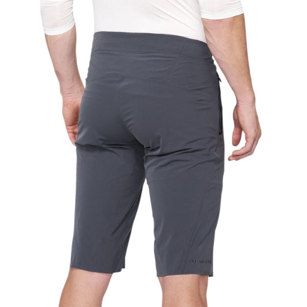 Studio photo of 100%, Celium Short (MTB), Shorts, SKU 50010050, color options Black, Charcoal, sizes 28–38, Designed for Mountain Bike, BMX and E-Bike riders