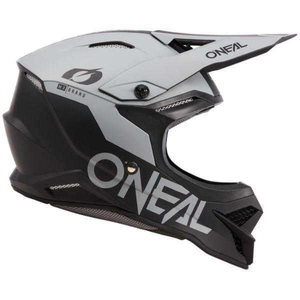 Studio image highlighting O'Neal, 3 Series Solid Black Cement V.24 Helmet, SKU 0627-034, color options Black/Cement, sizes XS–2X