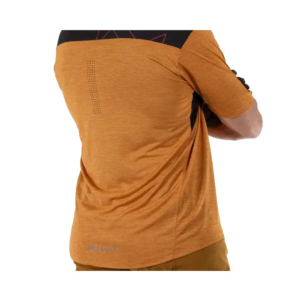 Product photo showing Leatt, Trail 1.0 Jersey (MTB) Mountain Bike in Black, Colors: Black, Loam, Rust, Teal, Sizes: 2-3, SKU: 5025103905