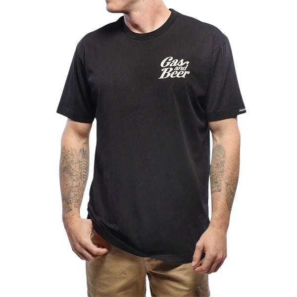 Professional studio photo of Fasthouse Tavern SS Tee; showing tee fit, printed graphics, and crew neckline; SKU 100026-00-; Colors: Black; Sizes: S-3XL