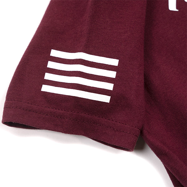 Professional studio photo of Fasthouse Logo Tee Maroon (Youth); showing tee fit, printed graphics, and crew neckline; SKU 32164740; Colors: Maroon