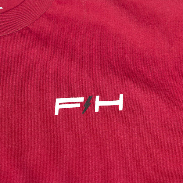 Clean studio shot of Fasthouse Elevate Tee; showing tee fit, printed graphics, and crew neckline; SKU 3211330104; Colors: Cardinal, Black, White