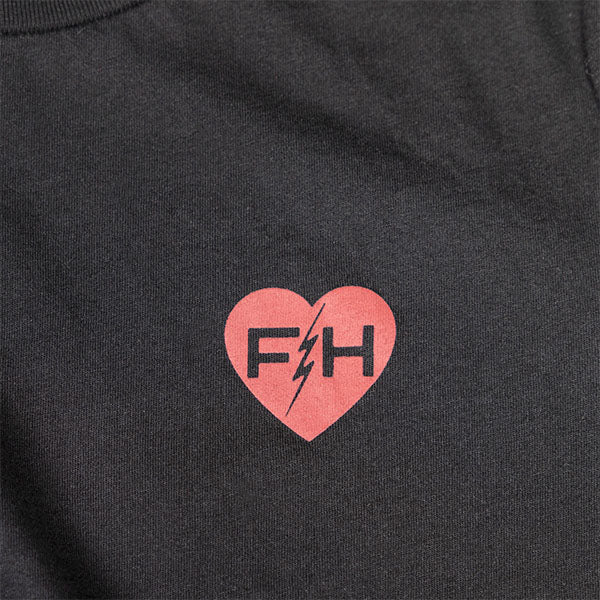 Studio photo on a white background of Fasthouse Stardom Tee (Womens); showing tee fit, printed graphics, and crew neckline; SKU 32117505; Colors: Black