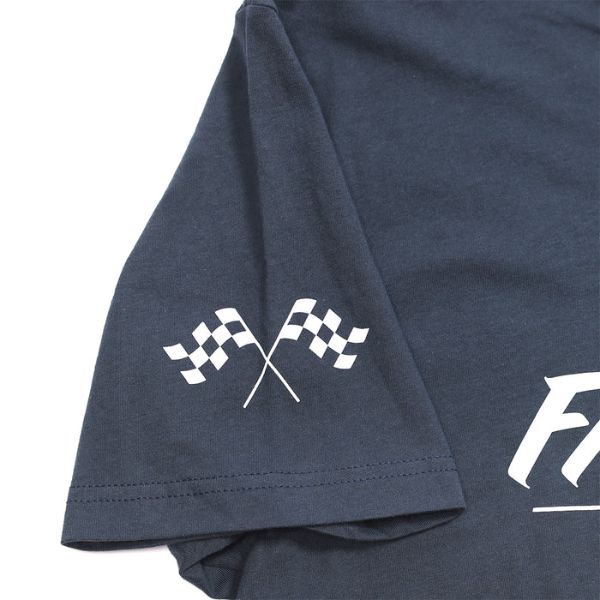 Professional studio photo of Fasthouse The Motto Tee; showing tee fit, printed graphics, and crew neckline; SKU 3210163004; Colors: Indigo, Black