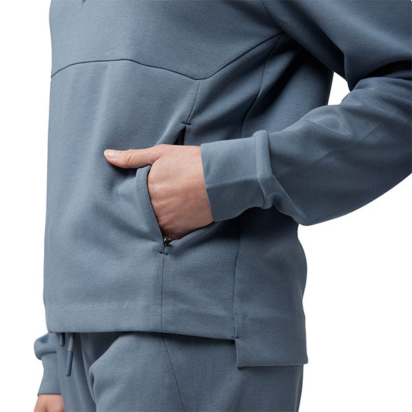 Lifestyle view of Fox Racing Women's Rise Pullover Hoodie in Heather Graphite (SKU: 34847-332), styled with joggers