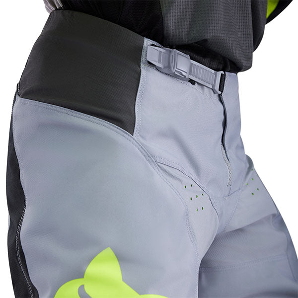 Action pose with White/Red 180 Flow Pants (SKU: 33703-019), showing fit and flexibility