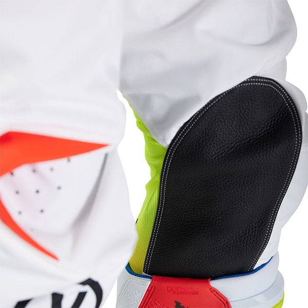 Action pose with White Hello Future Pants (SKU: 33542-008), showing flexibility and movement