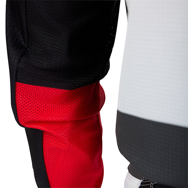 Action pose with Black/White 180 Flow Jersey (SKU: 33702-077), showing fit and flexibility