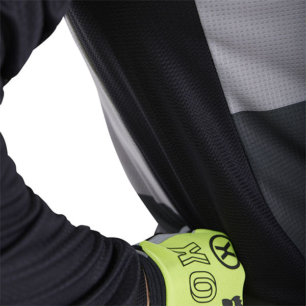 Action pose with White/Red 180 Flow Jersey (SKU: 33702-019), showing fit and mobility