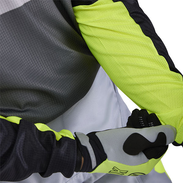 Side angle of White/Red 180 Flow Jersey (SKU: 33702-019), emphasizing ergonomic cut