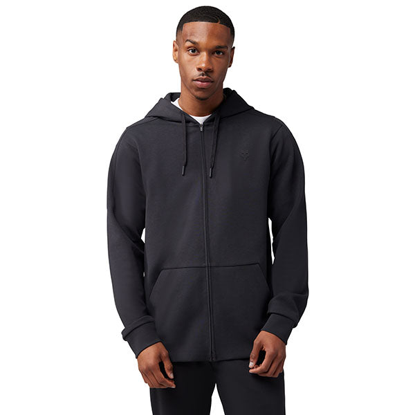 Side view of model wearing Rise Zip Hoodie in Black, SKU 33686-001, highlighting mesh side vents and 4-way stretch fleece