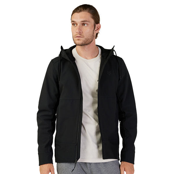 Lifestyle image of model wearing Fox Racing Pit Jacket in Black, SKU 33688-001, styled with casual pants
