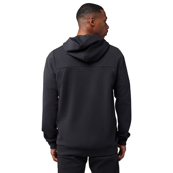 Lifestyle image of model wearing Fox Racing Rise Zip Hoodie in Black, SKU 33686-001, styled for training or casual wear