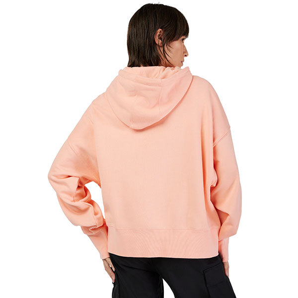 Lifestyle shot of model wearing Pale Pink Fox x Honda Hoodie, SKU 33574-273, styled with casual pants