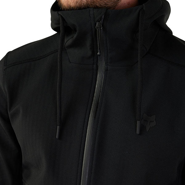 Rear angled view of Fox Racing Pit Jacket in Black, SKU 33688-001, showing extended back hem