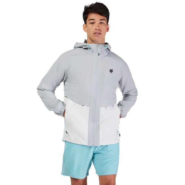 Side view of model wearing Survivalist Windbreaker in Dark Vintage, SKU 32616-172, highlighting articulated seams and stretch construction