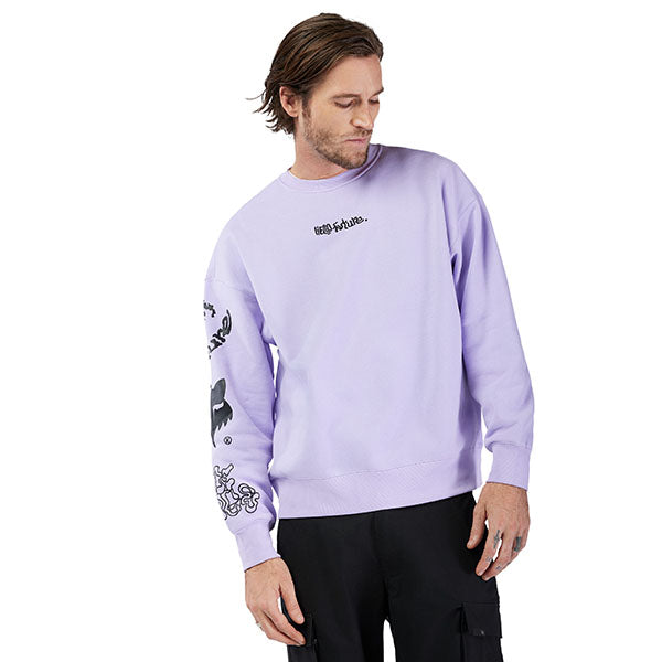 Lifestyle image of model wearing Fox Racing Hello Future Crew Pullover in Adobe, SKU 33379-282, styled with casual pants