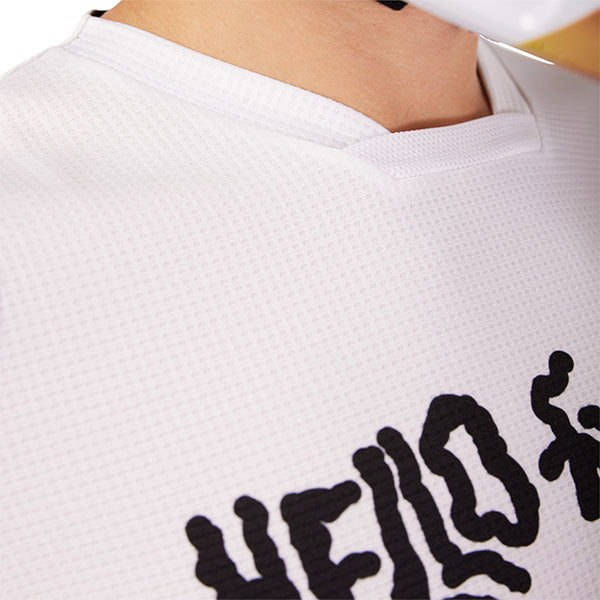 Side angle of Fox Racing 180 Hello Future Jersey in White and Yellow (SKU: 33534-008), emphasizing ergonomic fit