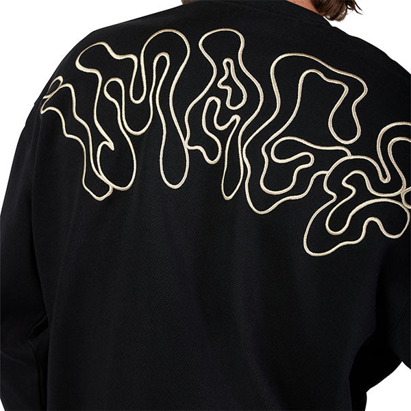 Side view of model wearing Hello Future Crew Pullover in Black, SKU 33379-001, highlighting oversized silhouette