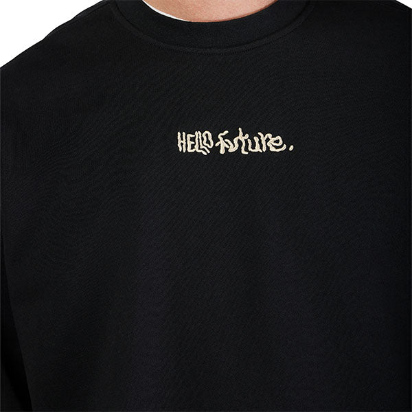 Lifestyle image of model wearing Fox Racing Hello Future Crew Pullover in Black, SKU 33379-001, styled with casual bottoms
