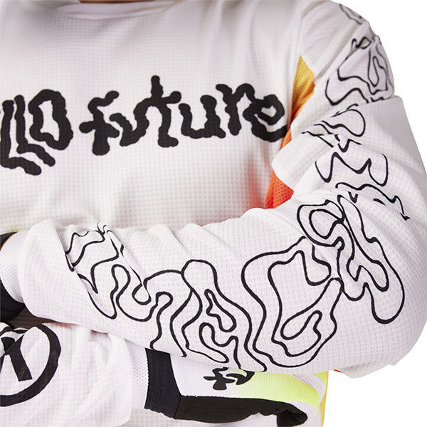 Action pose with Fox Racing 180 Hello Future Jersey in White and Yellow (SKU: 33534-008), showing flexibility and airflow
