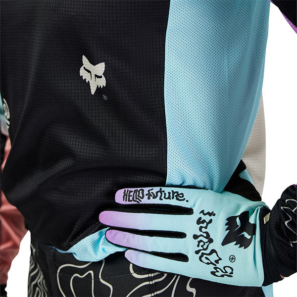 Action pose with Fox Racing 180 Hello Future Jersey in Black and Blue (SKU: 33534-001), showing flexibility and movement