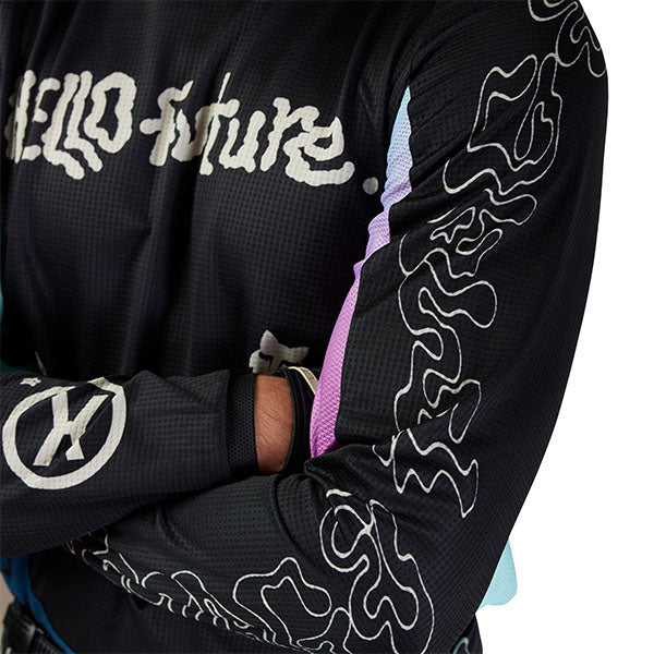 Full-body rider view wearing Fox Racing 180 Hello Future Jersey in Black and Blue (SKU: 33534-001), showing fit and mobility