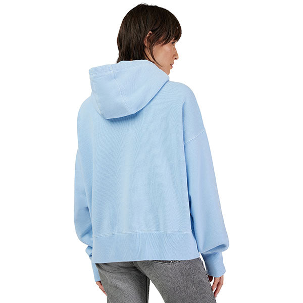 Lifestyle shot of model wearing Heather Graphite Fox Racing Hoodie, styled with casual bottoms