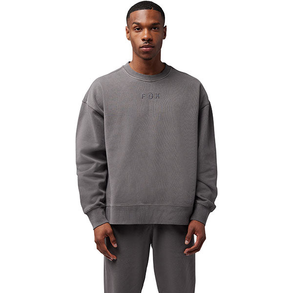 Side view of model wearing Wordmark Crew Pullover in Pewter, SKU 33142-052, highlighting ribbed hem and cuffs