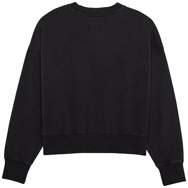 Side profile of Fox Racing Wordmark Oversized Crew Pullover for women in Black (SKU: 33140-001), showing relaxed fit and ribbed cuffs