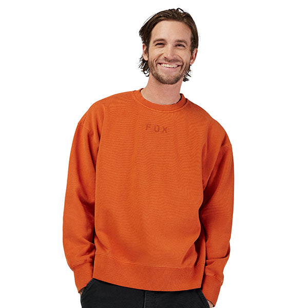 Side view of model wearing Wordmark Crew Pullover in Light Blue, SKU 33142-633, highlighting ribbed cuffs and hem