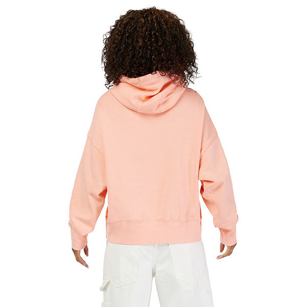 Lifestyle shot of model wearing Pale Pink Fox Racing Moto-X Hoodie, styled with casual bottoms