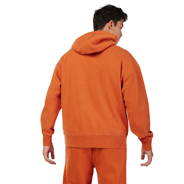 Side view of model wearing Wordmark Hoodie in Light Blue, SKU 32865-633, highlighting drawcord hood and ribbed cuffs