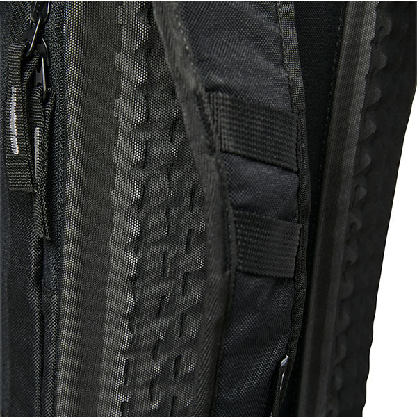 Fox Racing Utility 12L Hydration Pack SKU 28407 Black side view showing low-profile pack dimensions