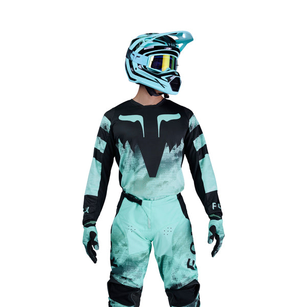 Side view of turquoise 180 Kairos Jersey showing sleeve cuffs and vented mesh paneling, SKU 36313-295 | SKU: 36313-29 | Available at BTO Sports
