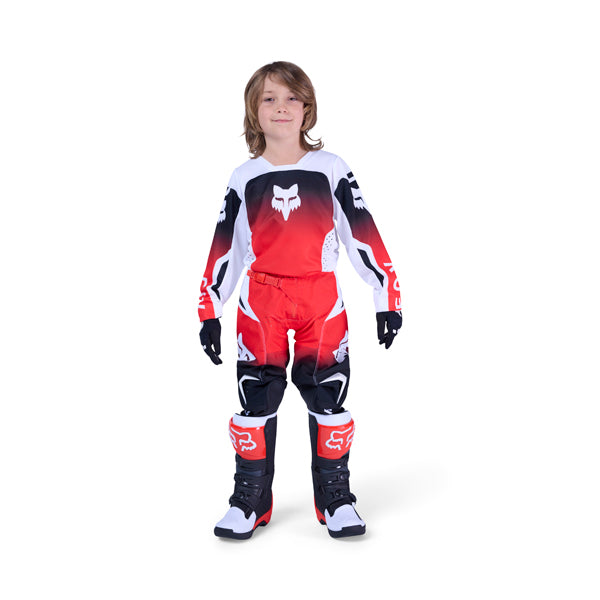 Front view of Fox Racing 180 women's motocross jersey and pants in black with white logos