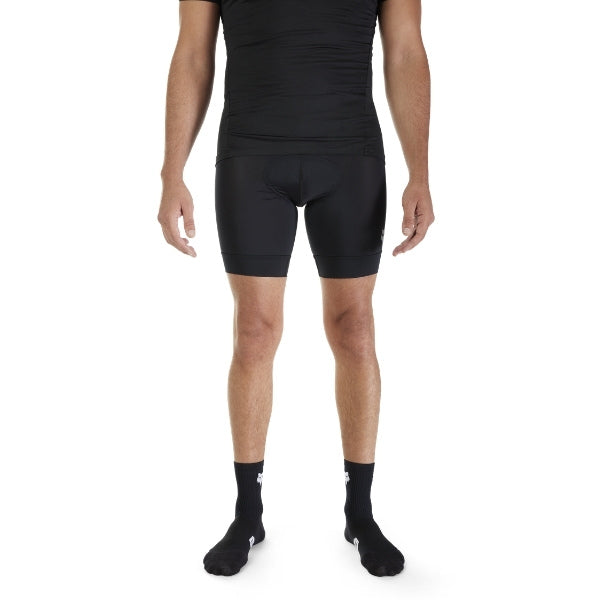 Fox Racing Tecbase Lite Liner Shorts (MTB) in Black, modeled waist and hip view, with the fitted stretch body, flat seams, wide waistband, shaped leg openings, and Fox waist logo. Available options—Color: Black; Size: SM, MD, LG, XL, 2X. SKU 33657-001-L. UPC 191972998010.